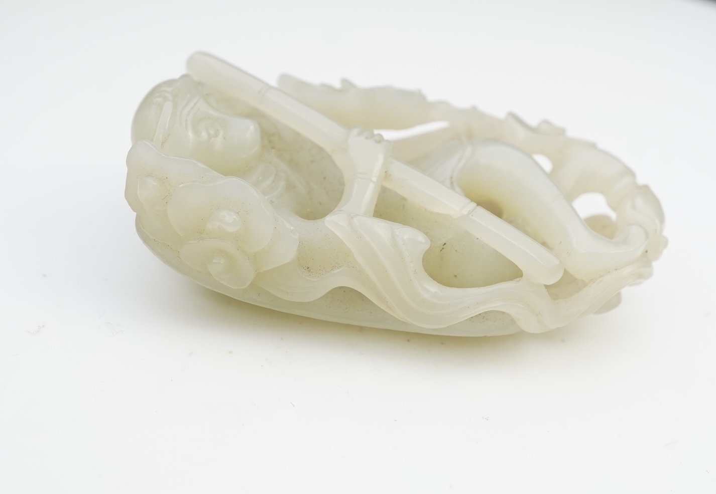 A Chinese pale celadon jade carving of Sun Wukong, the Monkey King, 18th/19th century